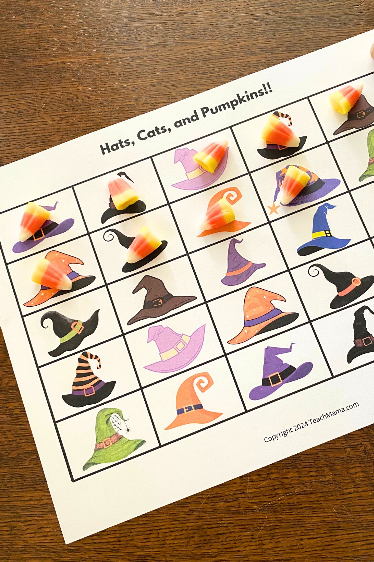 Printable grid game board with colorful cartoon witches' hats