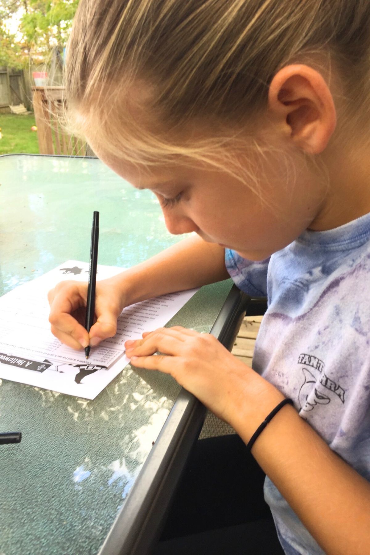 Girl playing a fill-in-the-blank story puzzle