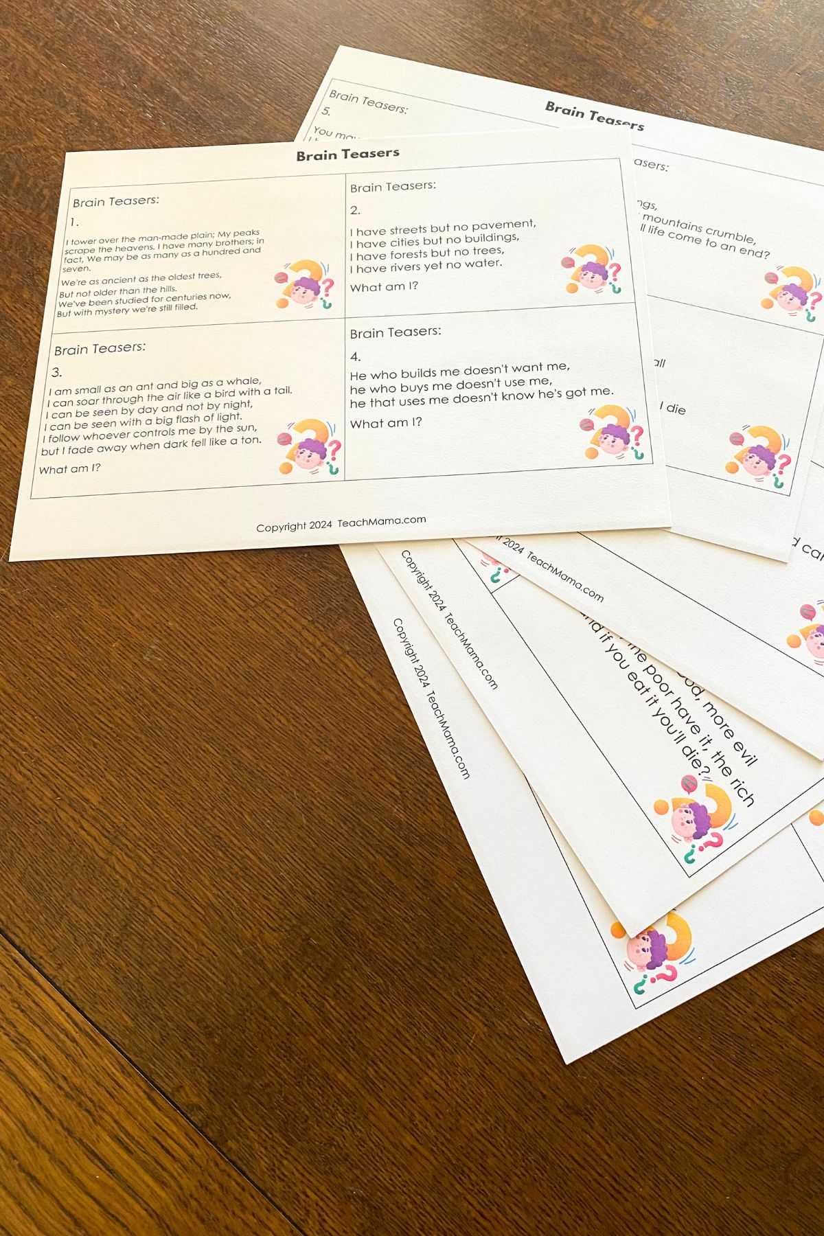 brain teaser lunchbox notes printed on white card stock on a wooden table