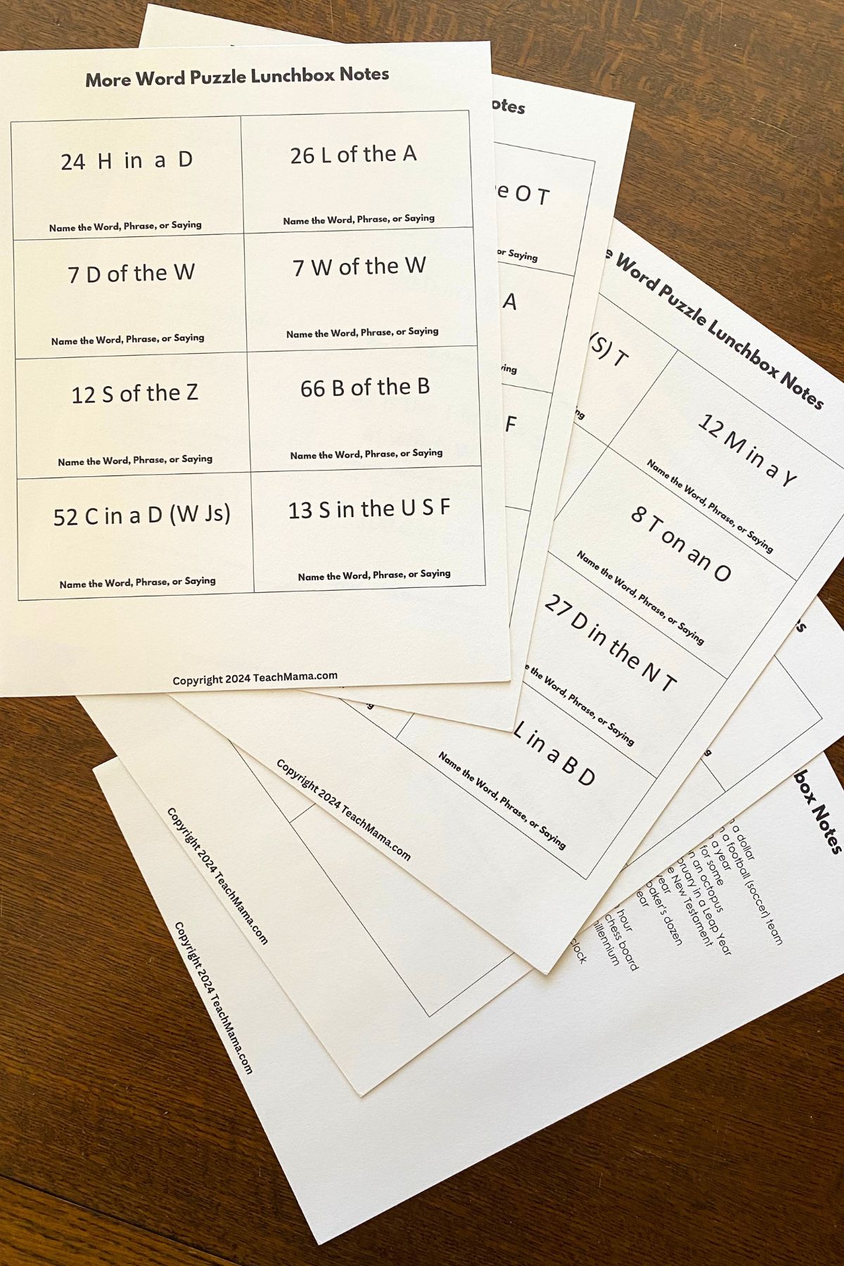 Word Puzzles printed on white card stock on a wooden table