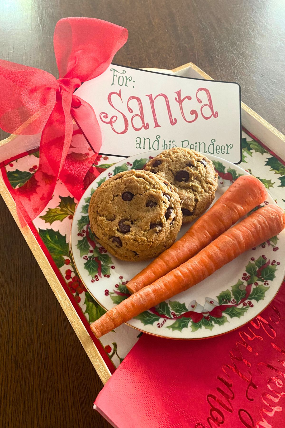 Carrots and cookies on a Christmas plate and Christmas-themed tray