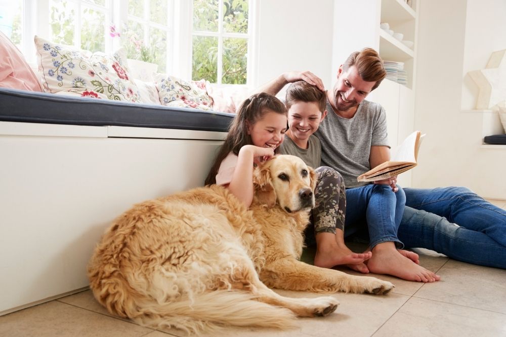 family with their dog