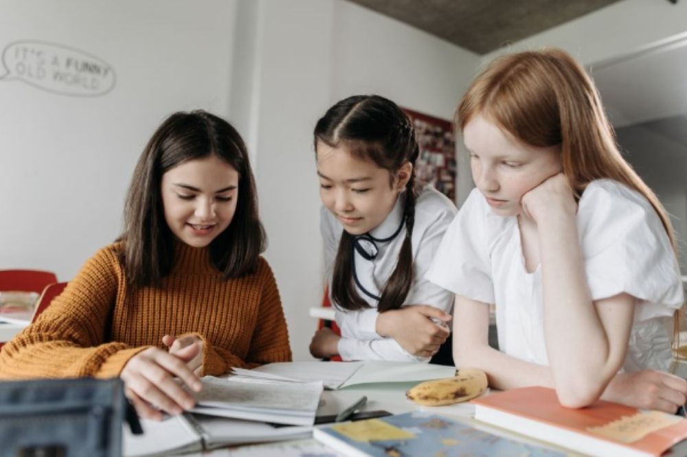 female kids studying together