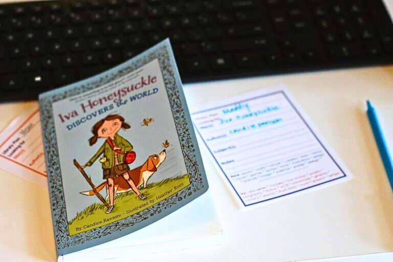 Child's book on a table with a printed library plan on the table next to it