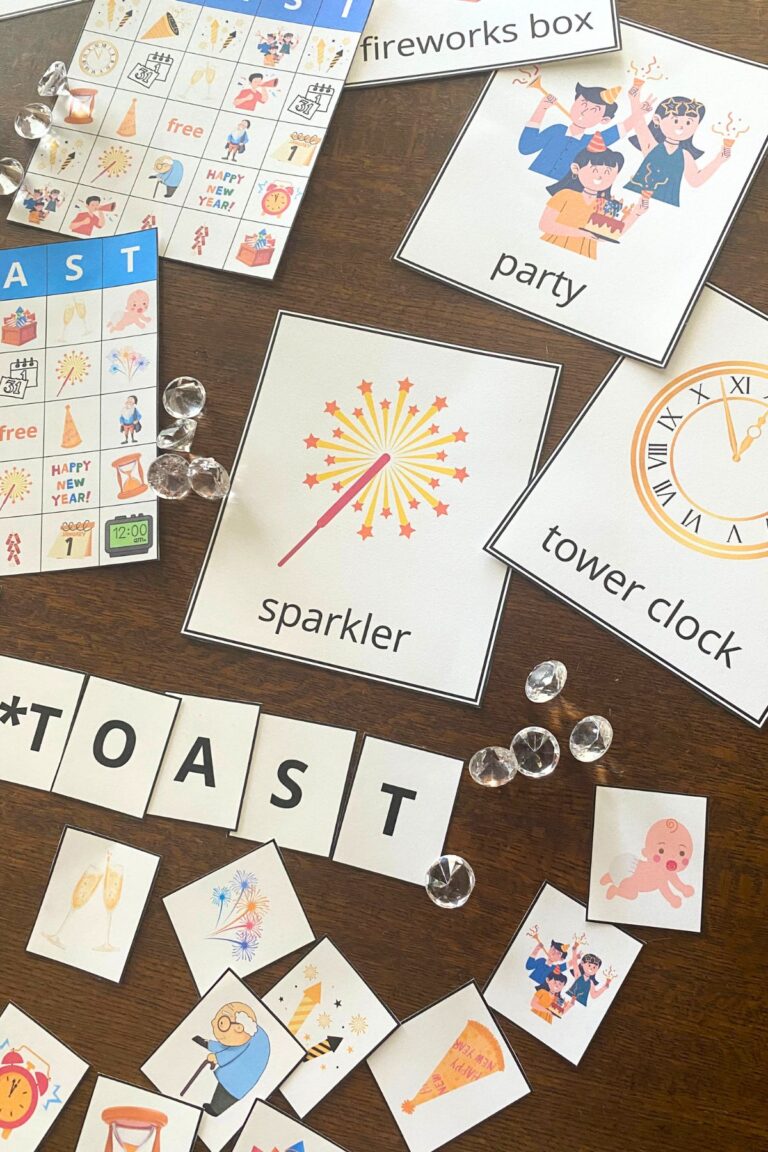 Colorful New Year themed bingo playing boards and cards on a wooden table