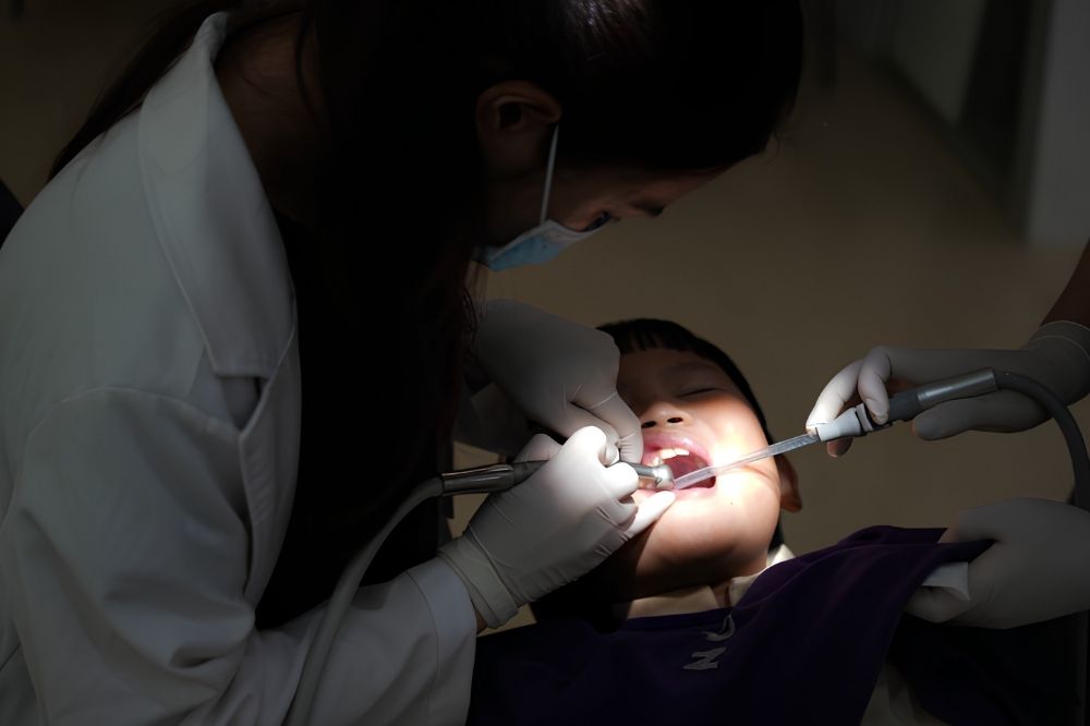 Dentist treating a young boy's teeth