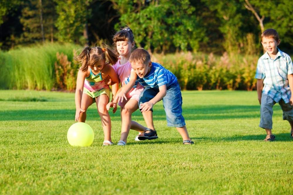 Kids playing outdoor with ball