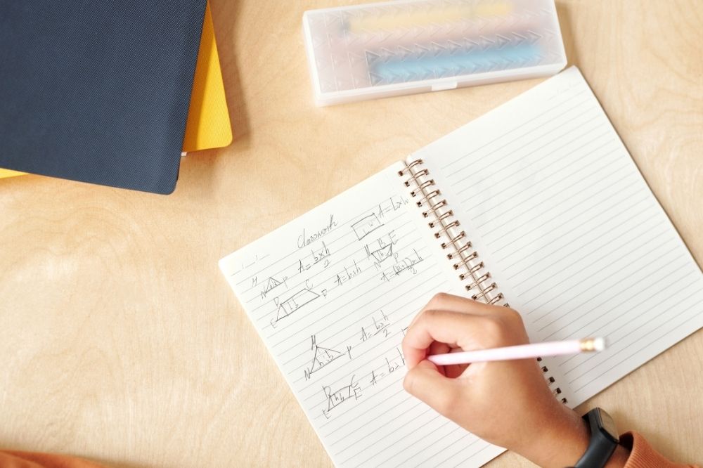 hand writing in a notebook