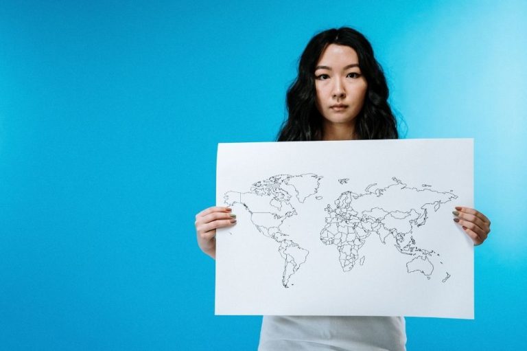 A teenager holding a map