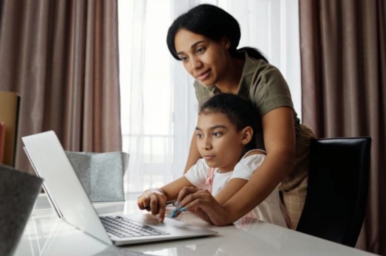 Mom helping his son on his studies